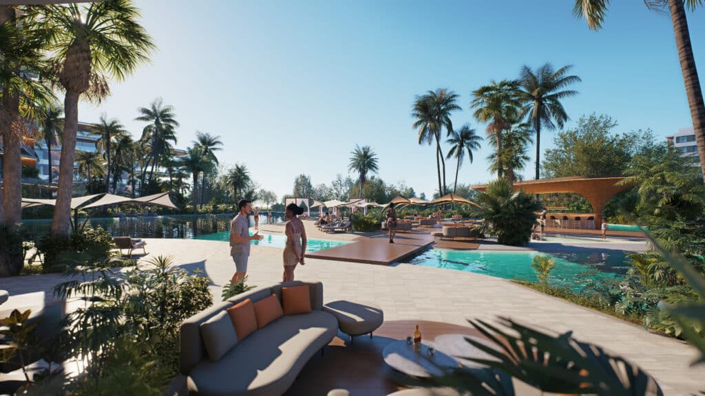 Piscina resort en Makai Residences Cap Cana con áreas de descanso y bar exterior